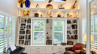 White built-in library with a rolling ladder