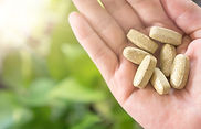 vecteezy_top-view-of-alternative-organic-medicine-tablet-on-woman-s-hand_2076453(low).jpg