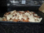 double batch of rolled sugar cookies afer they were baked. sitting on a cookie sheet in a large pile