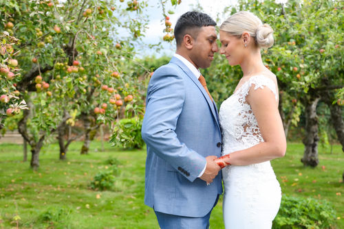 Beautiful couple photoshoot with apple trees in background