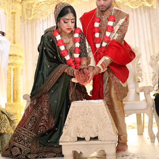 Hindu wedding ceremony, putting rice into the fire