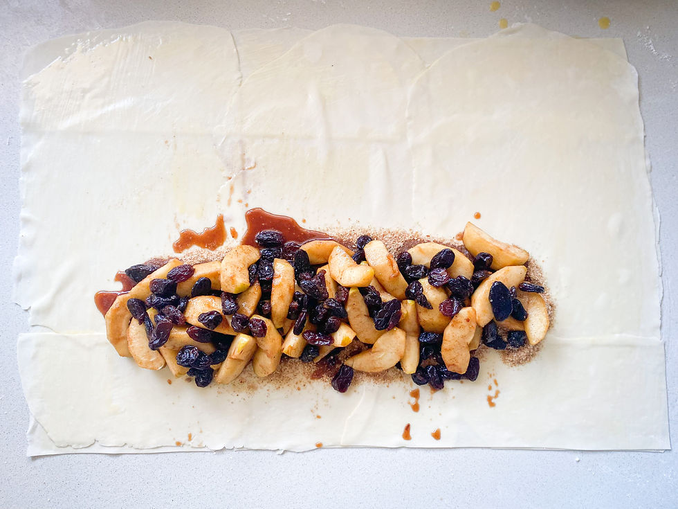A large rectangle of Gluten Free Filo Pastry topped with breadcrumbs and spiced fruit.