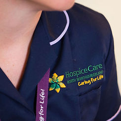 Image of our logo on uniform.jpg