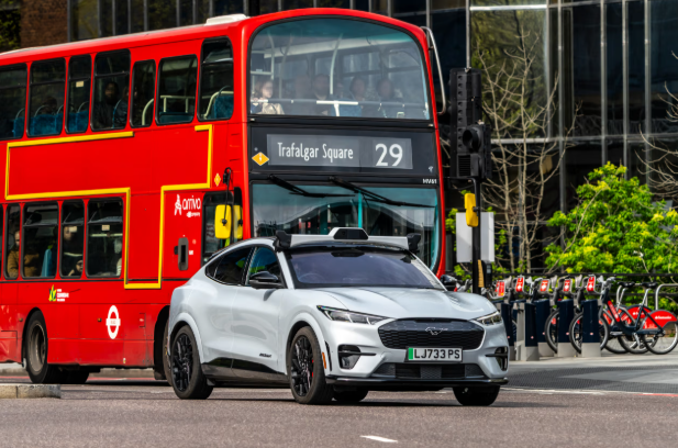 Autonomous taxi operating on a busy London street as Uber and Wayve launch self-driving transportation