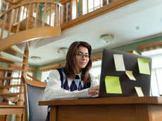University student working remotely on an online internship from a laptop