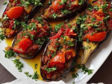 Homemade İmam Bayıldı Recipe featuring tender roasted eggplant filled with sweet tomatoes, onions and olive oil