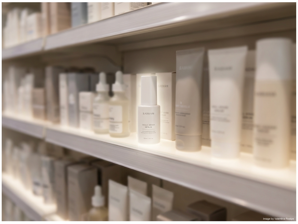 Minimalist skincare product standing out on a pharmacy shelf, surrounded by other products, highlighting how clean design creates a premium perception in a retail environment.