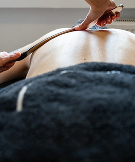Physiotherapist correcting joint pain of male patient with IASTM tool, Instrument assisted