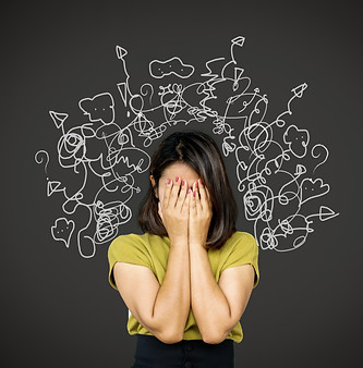 Woman feeling overwhelmed by anxiety