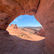 a view of Delicate Arch in Arches National Park, while looking through a different arch