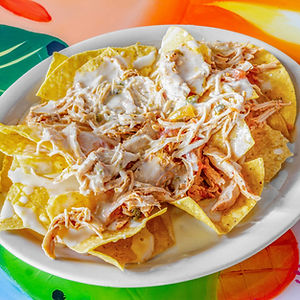 NACHOS WITH BEEF OR CHICKEN