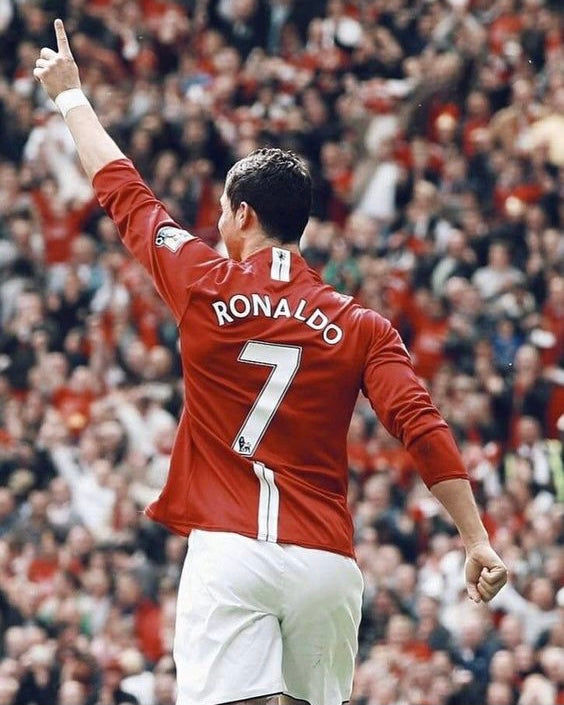 Cristiano Ronaldo celebrates victory wearing the Manchester United jersey with the number seven.