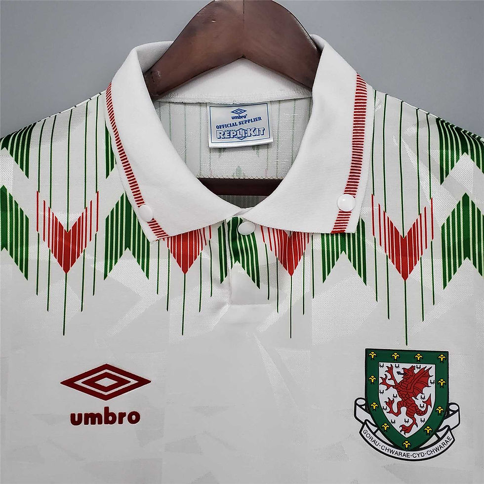 Thumbnail: White Wales retro football shirt with geometric design and Umbro logo.