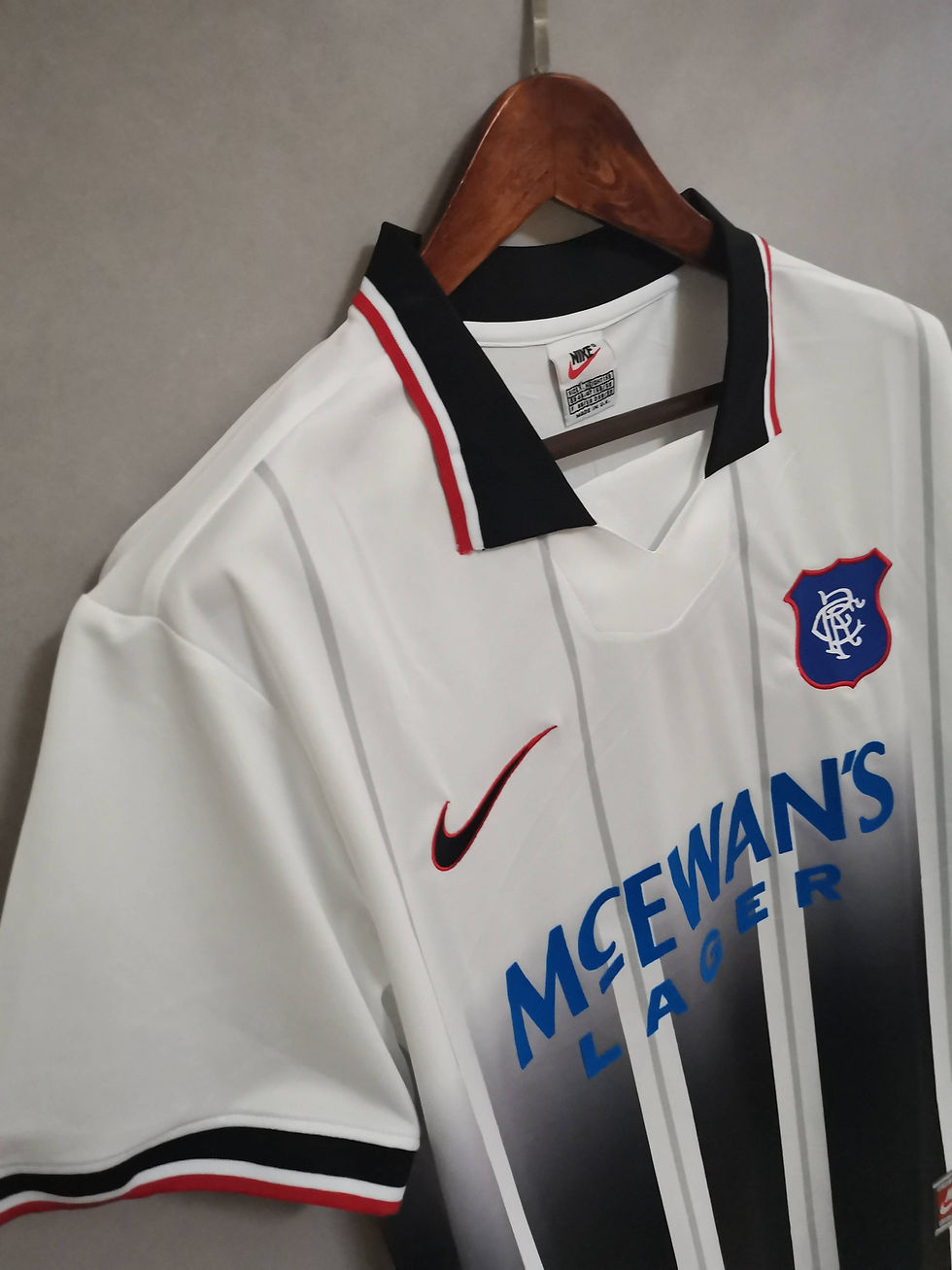 White Rangers jersey Nike McEwan's Lager logo and retro football kit.