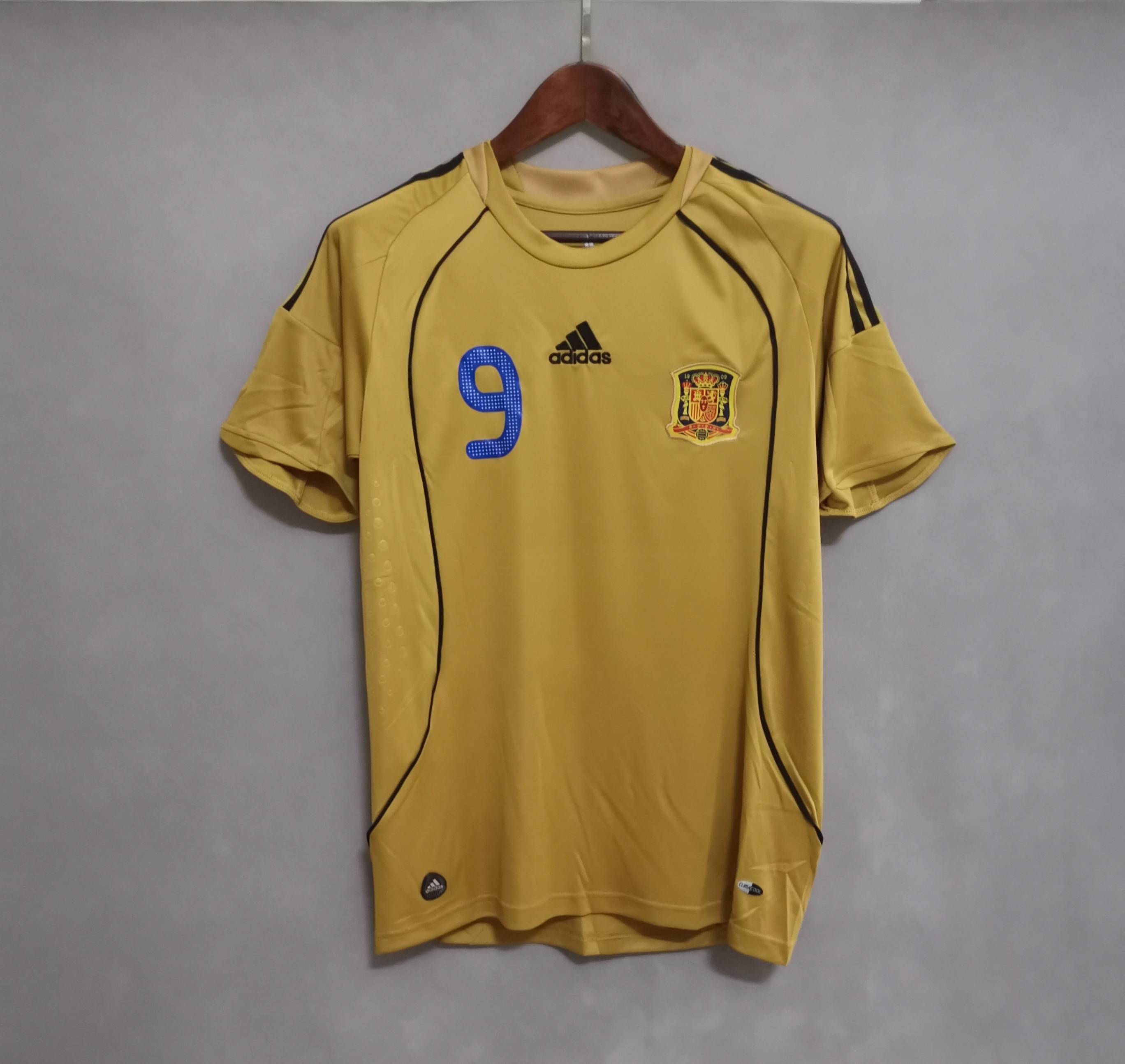 Yellow football shirt with number 9 Adidas logo, Nostalgia Retro Kit.