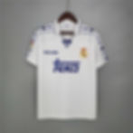 White Real Madrid jersey with Teka logo and Kelme brand, retro styling.