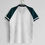 Thumbnail: White retro football shirt with green sleeves and collar details. Nostalgia Retro Kit.