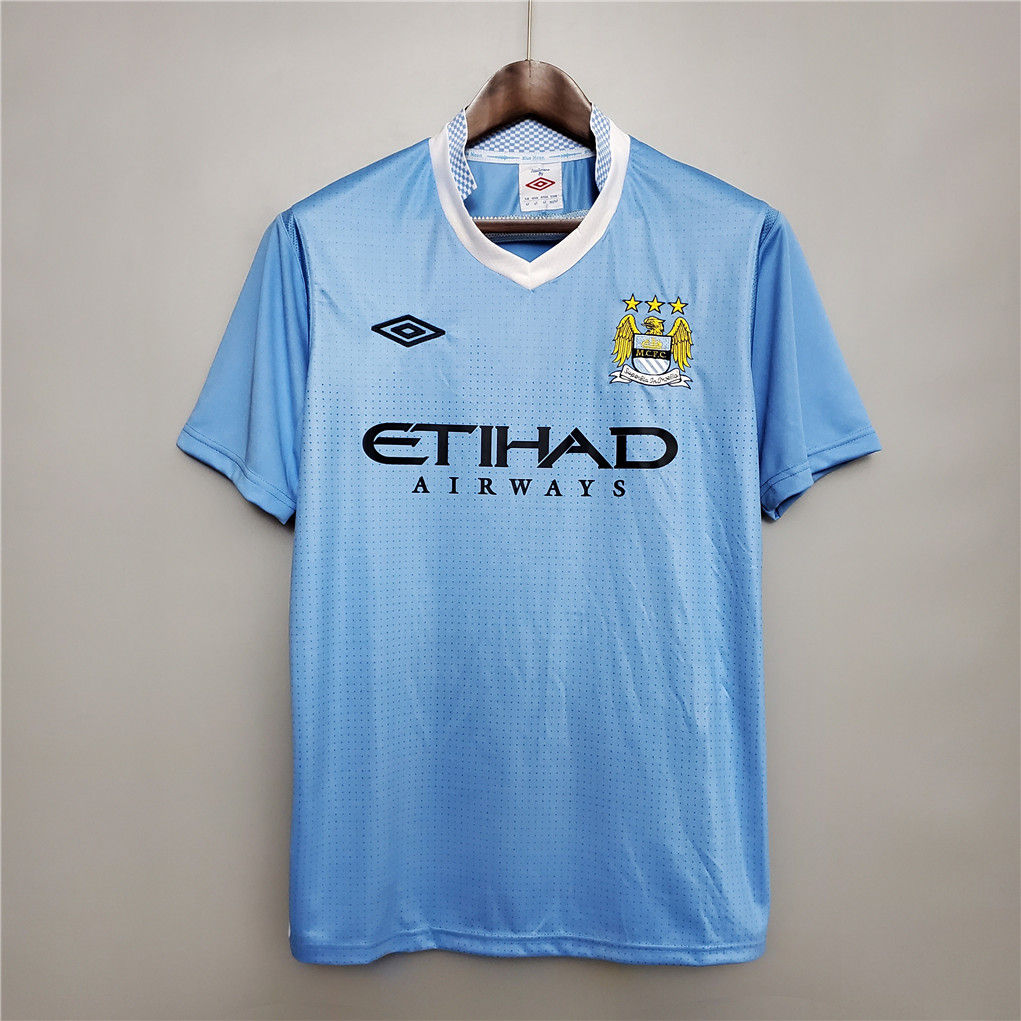 Light blue Manchester City football shirt with Etihad Airways text. Nostalgia Retro Kit