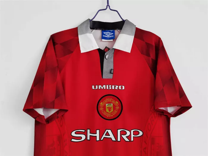 Thumbnail: Red Manchester United Umbro Sharp retro jersey, team logo, and details.