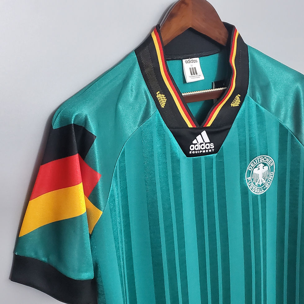Thumbnail: Green Germany retro football shirt with Adidas logo and German flag details.