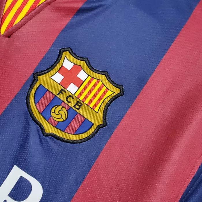 Thumbnail: Close-up of FC Barcelona jersey with team logo and stripes detail.