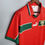 Thumbnail: Red Morocco soccer jersey with green accents and Puma logo on display.