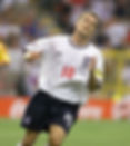 Michael Owen in England's white shirt number 10, running on the field.
