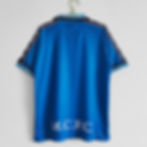 Blue retro Manchester City football shirt with M.C.F.C text. Nostalgia Retro Kit