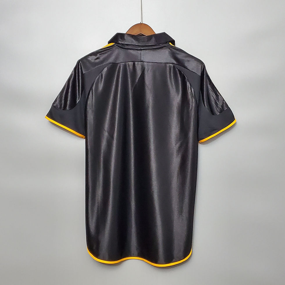 Thumbnail: Black retro jersey with yellow trim hanging on a wooden hanger Nostalgia Retro Kit