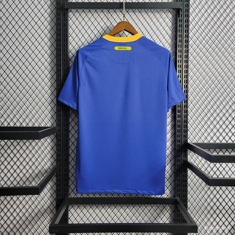 Thumbnail: Blue football jersey with yellow details hanging on display, Nostalgia Retro Kit.
