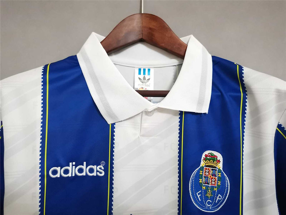 Thumbnail: Close-up Adidas jersey with white collar and blue stripes, retro football kit.