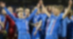 Icelandic soccer team celebrating a victory, players wearing blue jerseys, cheering each other.