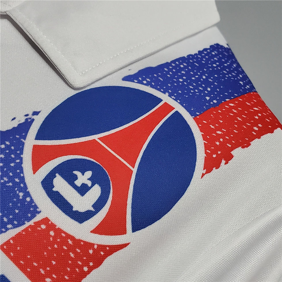 Thumbnail: Close-up of white shirt with logo and color design. Nostalgia Retro Kit.