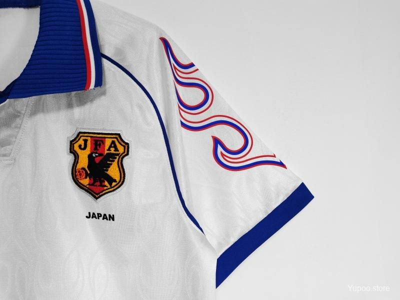 Thumbnail: White Japan football shirt with JFA logo and red and blue flames design.