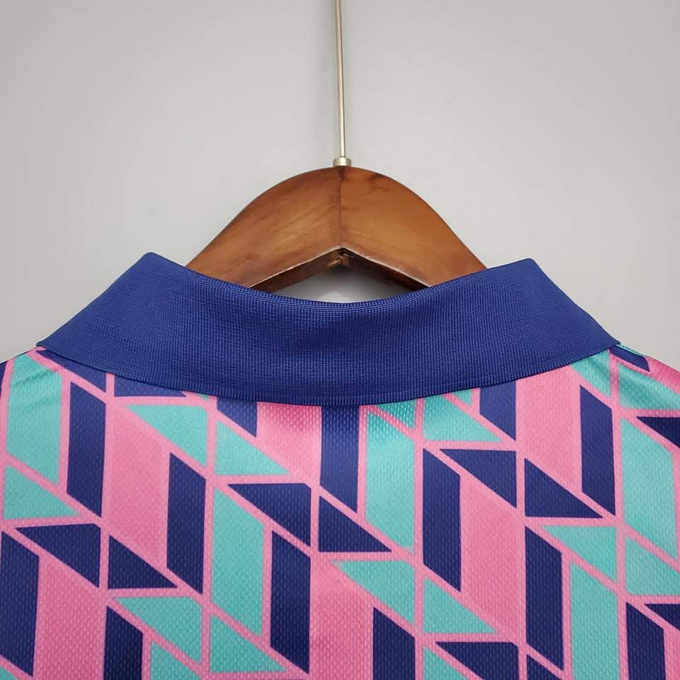 Thumbnail: Close up of the retro jersey collar with shades of blue, pink and green.