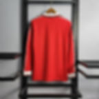 Thumbnail: Red shirt, white stripe, long sleeve, retro style, hanging on a black rack.