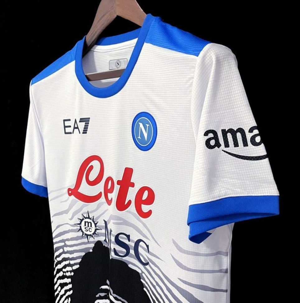 Thumbnail: White jersey with EA7, SSC, and amazon logos; blue and white details.