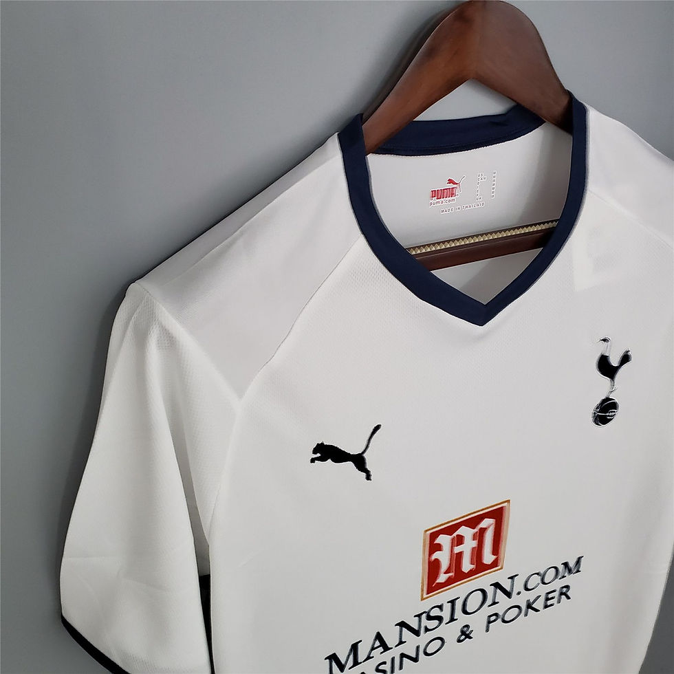 Thumbnail: White Tottenham Hotspur jersey with Puma logo and Mansion Casino visible from image.