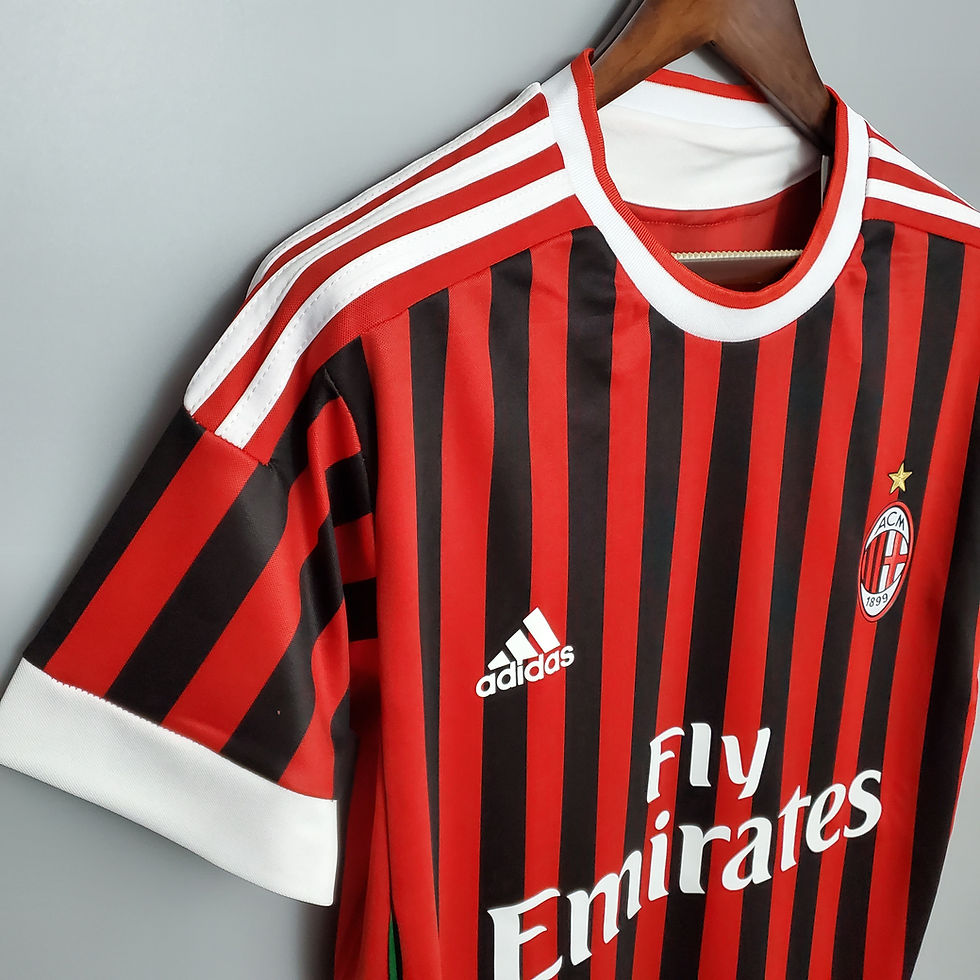 Thumbnail: Close-up of AC Milan jersey with Adidas logo and Fly Emirates text.