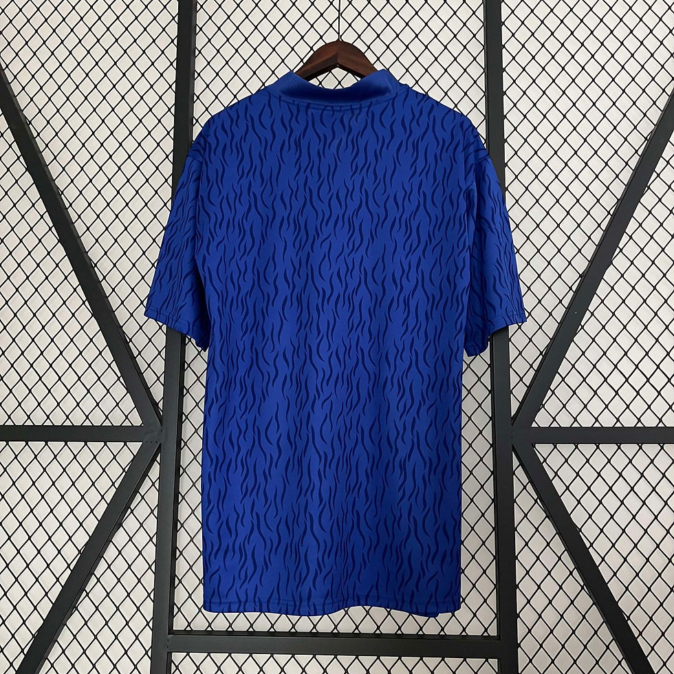 Thumbnail: Blue shirt on hanger, showcasing a textured pattern and short sleeves.