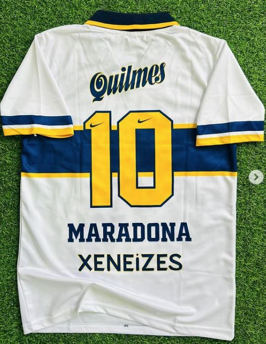 Quilmes 10 Maradona Xeneizes white soccer jersey, blue stripes, retro kit.