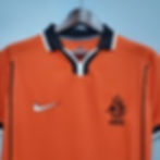 Thumbnail: Orange Dutch football jersey with white and black details, Nike logo, KNVB emblem.