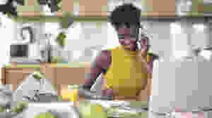 Black woman at her desk working.