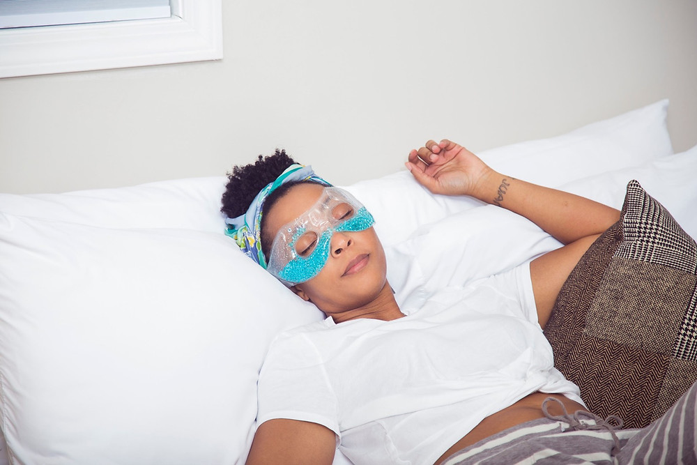 Woman resting with an eye mask