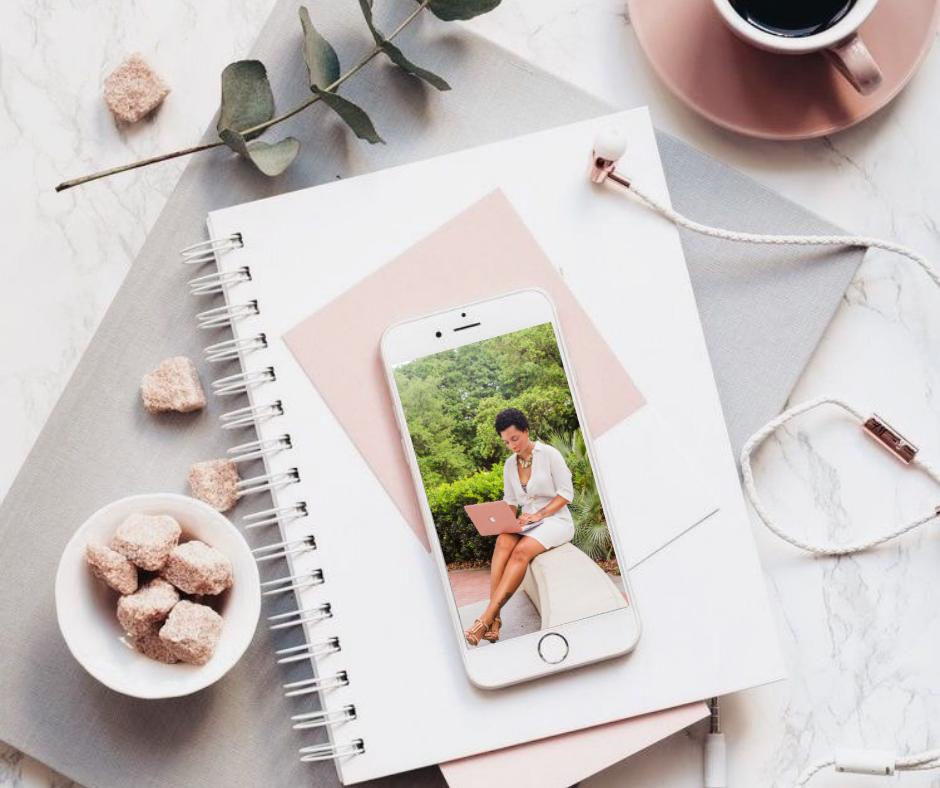 flatlay with notebook, coffee, phone and earphones