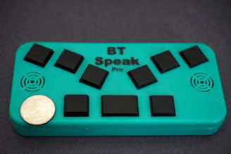 Image of a quarter placed on top of BT Speak Pro to emphasize scale
