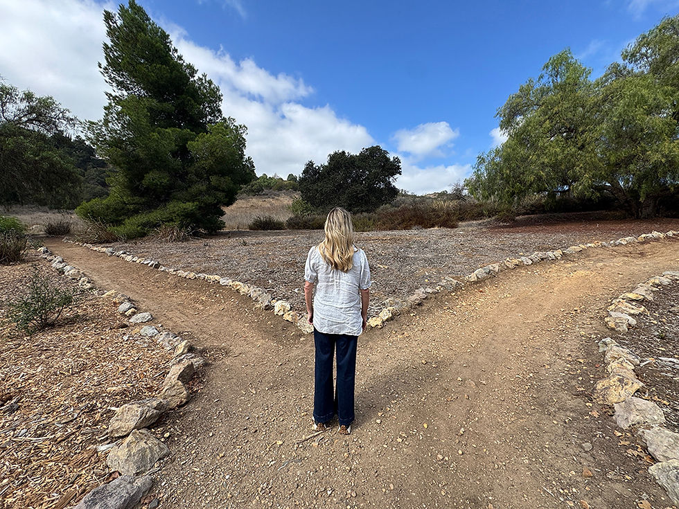 Woman trying to make a decision on which path to take on her journey to genuine, lasting love.