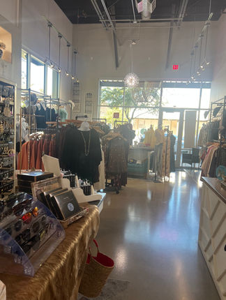 Interior of Apricot Lane Boutique Queen Creek featuring curated women’s clothing racks and an inviting shopping atmosphere