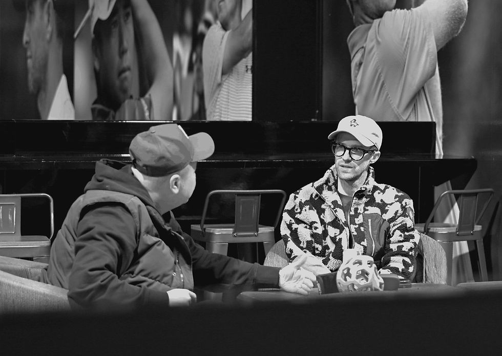 Brand advisor in strategic discussion with business leader, symbolizing brand clarity, leadership guidance, and long-term strategic positioning.