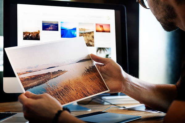Man looking at photograph